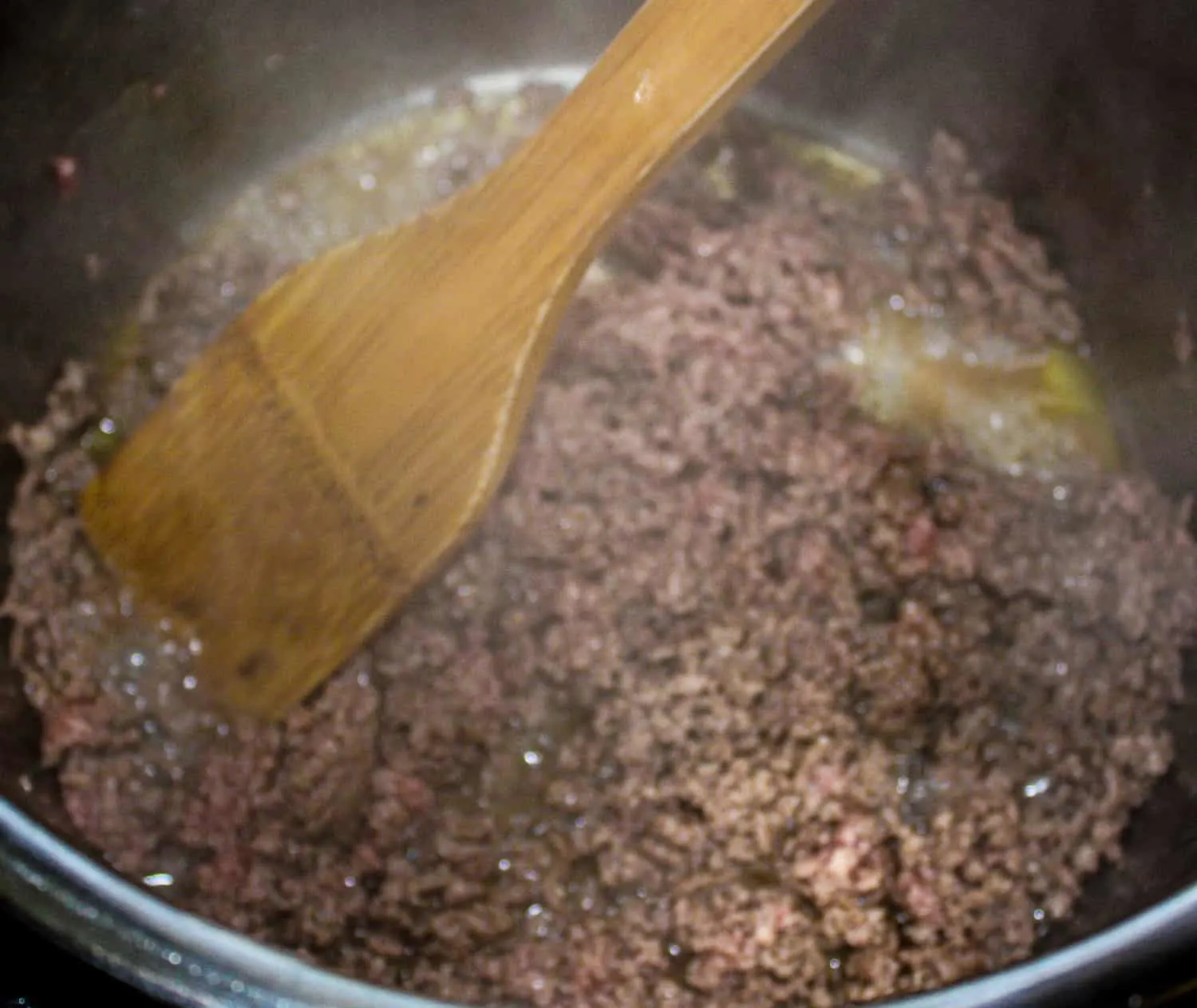 Browning the ground beef.