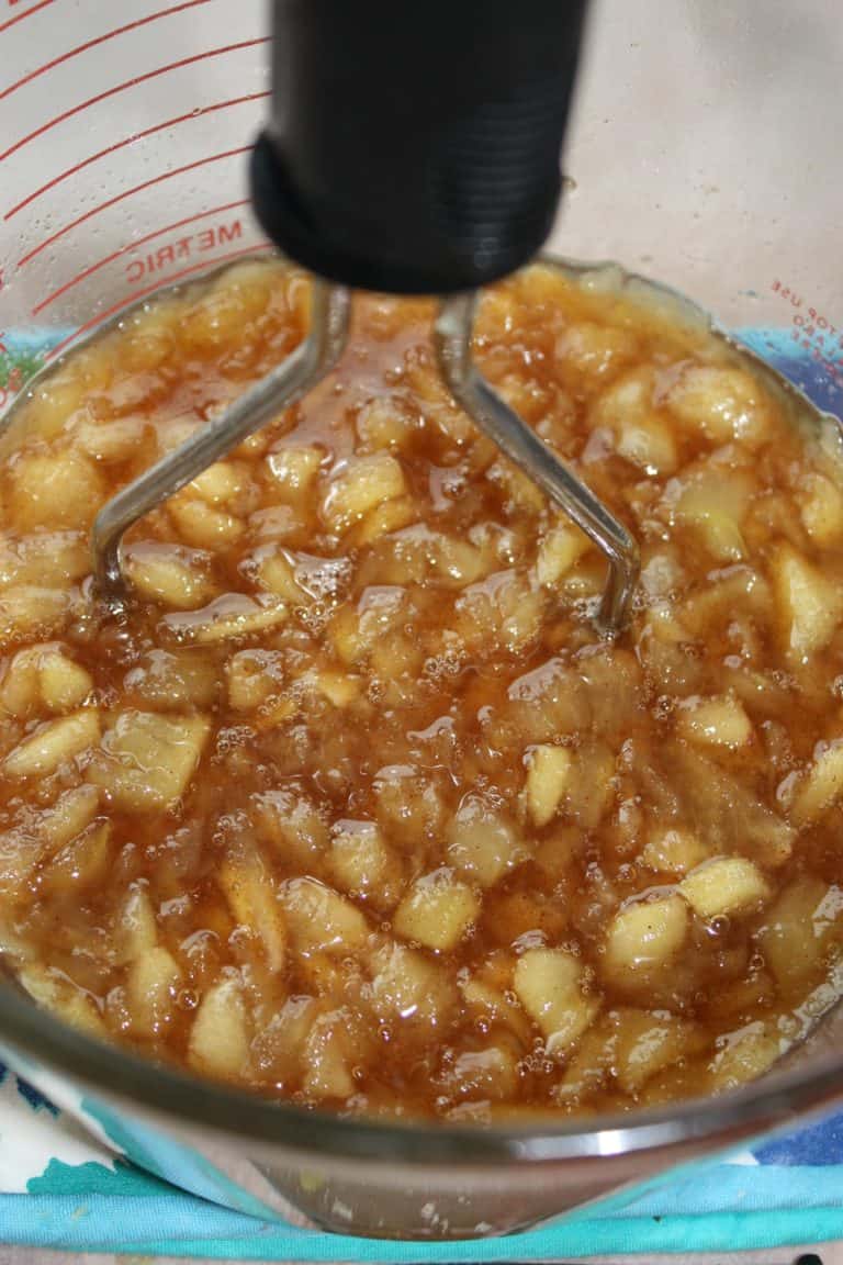 Mashing the apples.