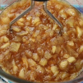 Mashing the apples.