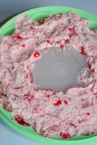 This Strawberry Jello Mold is a tasty variation to add to your holiday get togethers in place of the Orange Jello Mold.  My grown children expect to see one on the table when they return home for the holidays.