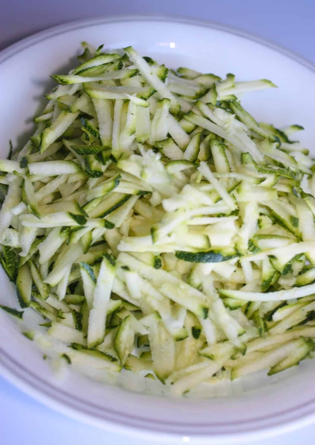 The grated zucchini.