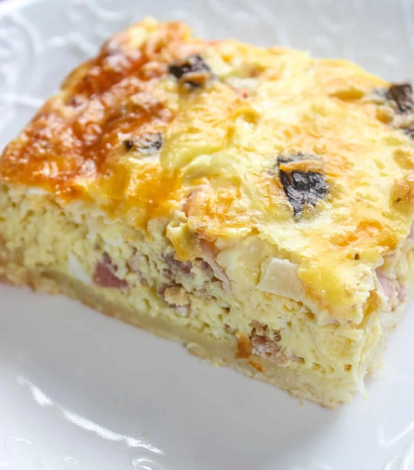 This Breakfast Casserole is a great alternative to the standard bacon and egg brunch or breakfast.  The egg layer is loaded with vegetables and meat before it is poured over a gluten free crust.