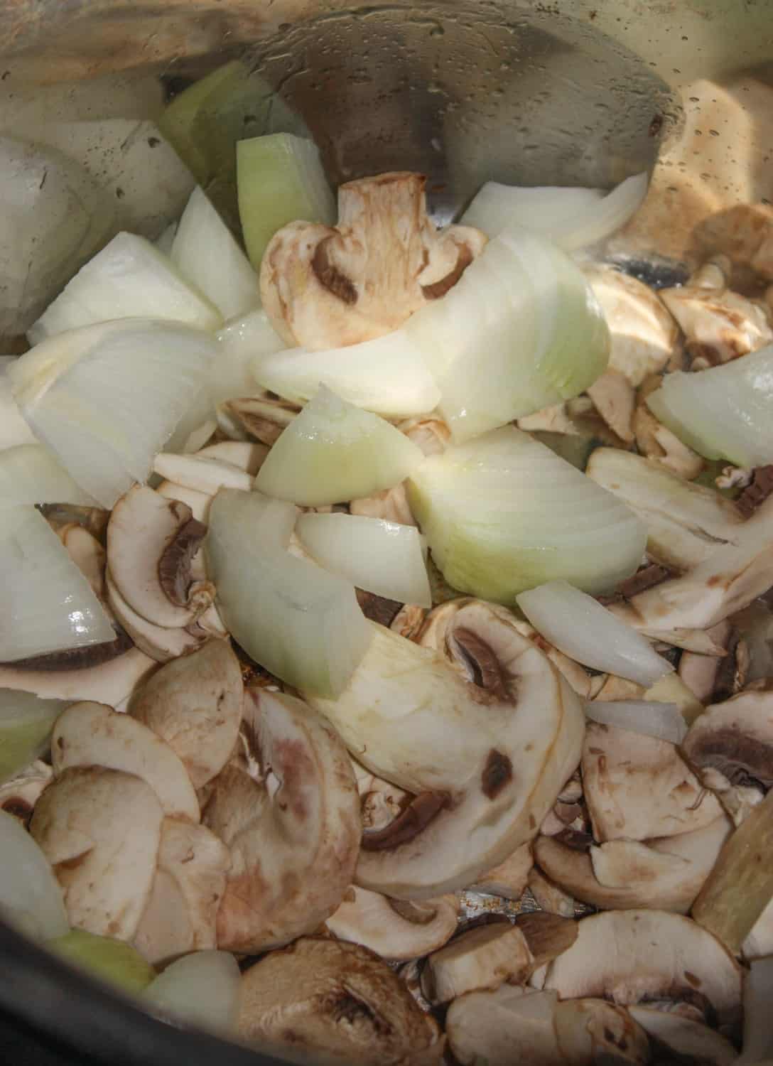 Adding the mushrooms and onion.