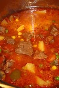 Adding the frozen peas and corn.