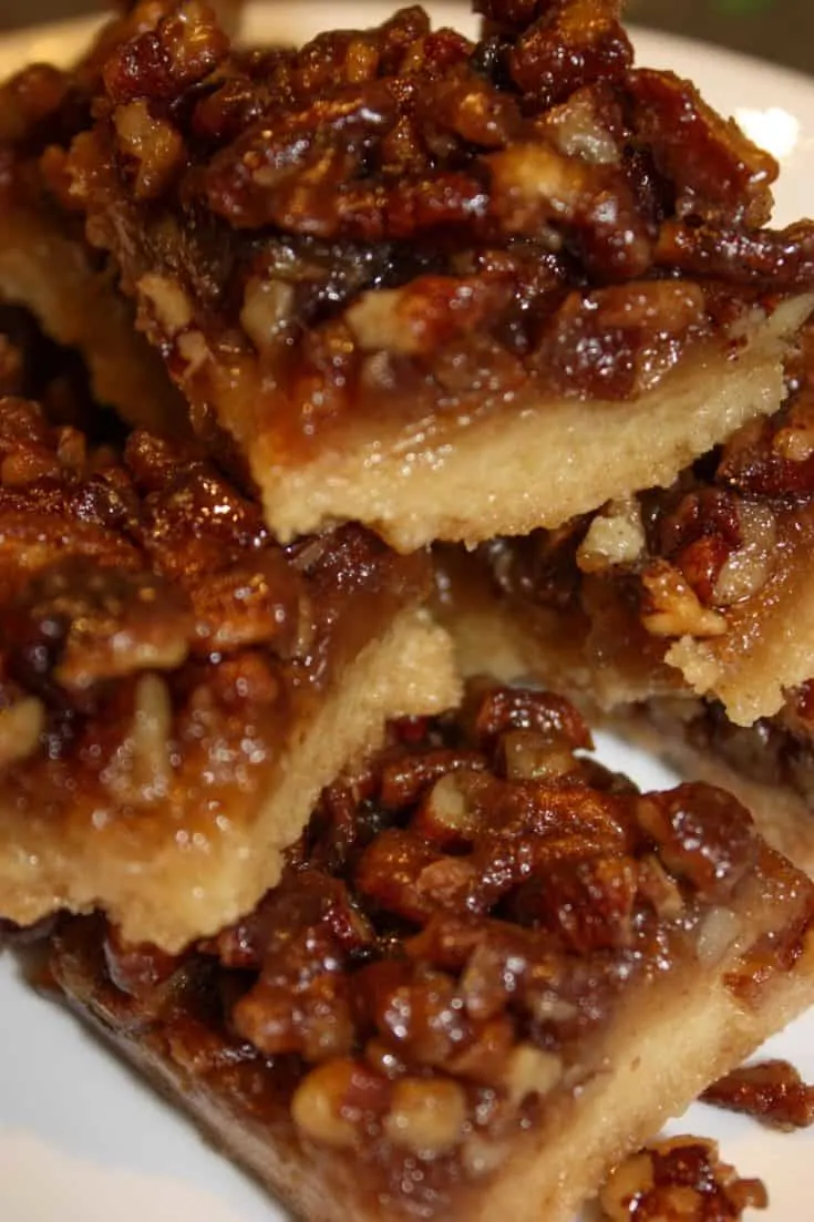Pecan Pie Squares are a chewy, flavourful dessert square that will be a perfect addition to your holiday dessert tray.  This gluten free version will surprise your guests that are able to consume a regular diet.