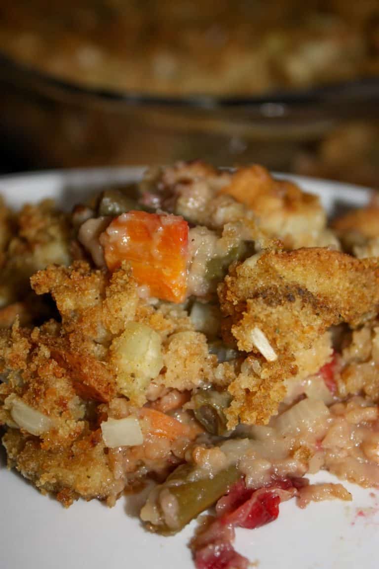 Festive Green Bean Casserole is a gluten free holiday variation that is loaded with stuffing and cranberries.