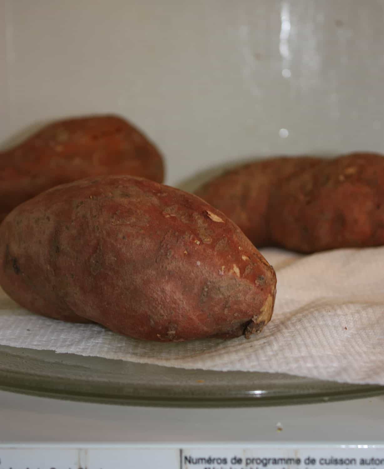 Cook sweet potatoes in microwave.