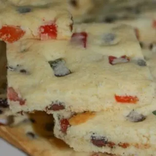 Festive Shortbread Cookie Bars are a colourful addition to any holiday dessert tray.  This gluten free version will certainly hit the spot for anyone whether they have a gluten intolerance or can eat a regular diet.