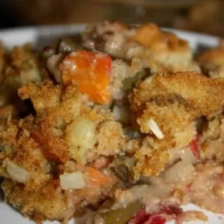 Festive Green Bean Casserole is a gluten free holiday variation that is loaded with stuffing and cranberries.