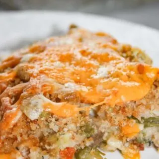 Green Bean Casseroles are a traditional side dish in many homes.  This Cheesy Garlic Green Bean Casserole is a flavourful gluten free variation that will be sure to please the palates of both family and guests.