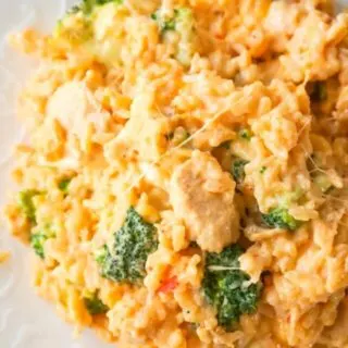Instant Pot Cheesy Broccoli Chicken and Rice is an easy pressure cooker dinner recipe made with long grain rice and loaded with chunks of chicken breast, broccoli florets, salsa con queso, mozzarella, cheddar and Parmesan.