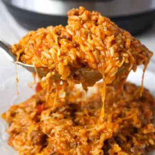 Instant Pot Cheesy Taco Ground Beef and Rice is an easy pressure cooker ground beef dinner recipe made with long grain white rice, corn and black bean salsa and Heinz chili sauce and loaded with shredded mozzarella and cheddar cheese.