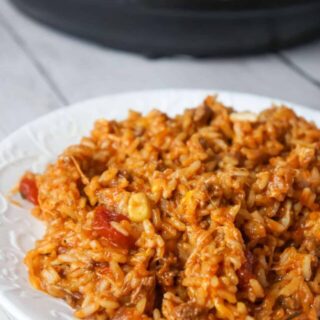 Instant Pot Cheesy Taco Ground Beef and Rice is an easy pressure cooker ground beef dinner recipe made with long grain white rice, corn and black bean salsa and Heinz chili sauce and loaded with shredded mozzarella and cheddar cheese.