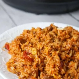 Instant Pot Cheesy Taco Ground Beef and Rice is an easy pressure cooker ground beef dinner recipe made with long grain white rice, corn and black bean salsa and Heinz chili sauce and loaded with shredded mozzarella and cheddar cheese.