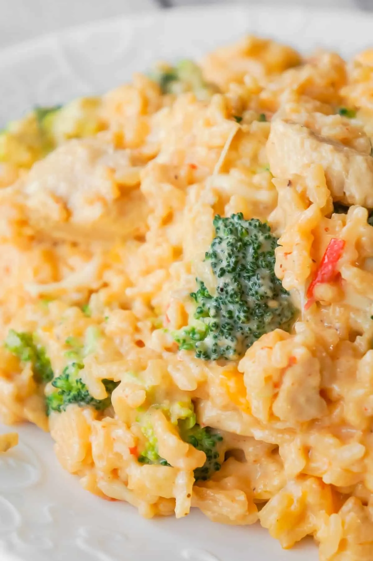 Instant Pot Cheesy Broccoli Chicken and Rice is an easy pressure cooker dinner recipe made with long grain rice and loaded with chunks of chicken breast, broccoli florets, salsa con queso, mozzarella, cheddar and Parmesan.