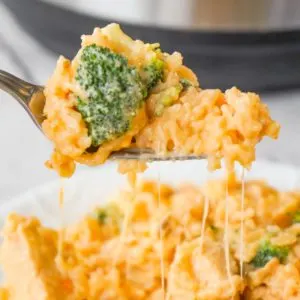 Instant Pot Cheesy Broccoli Chicken and Rice is an easy pressure cooker dinner recipe made with long grain rice and loaded with chunks of chicken breast, broccoli florets, salsa con queso, mozzarella, cheddar and Parmesan.
