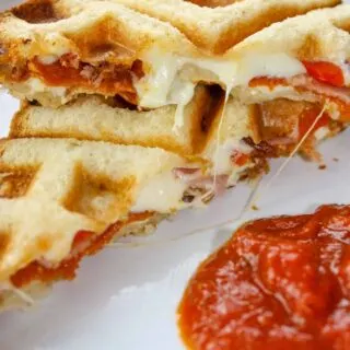 Craving pizza and do not have the time to make gluten free pizza crust from scratch.  Solution....Waffled Grilled Pizza Sandwiches!