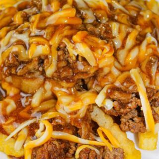Tex Mex Poutine is a quick and easy recipe that would be great for a Super Bowl Party.  But don't just save it for a special occasion because it deserves to be served any day of the year!
