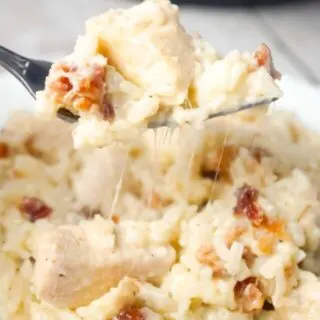 Instant Pot Bacon Parmesan Chicken and Rice is an easy pressure cooker chicken dinner recipe made with boneless, skinless chicken breasts and long grain rice, loaded with crumbled bacon and Parmesan cheese.