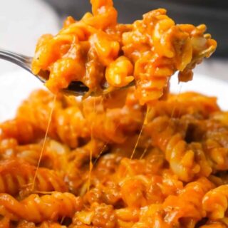 Instant Pot Cheesy Sloppy Joe Pasta is an easy gluten free pasta recipe loaded with ground beef, homemade sloppy joe sauce, mozzarella and cheddar cheese.