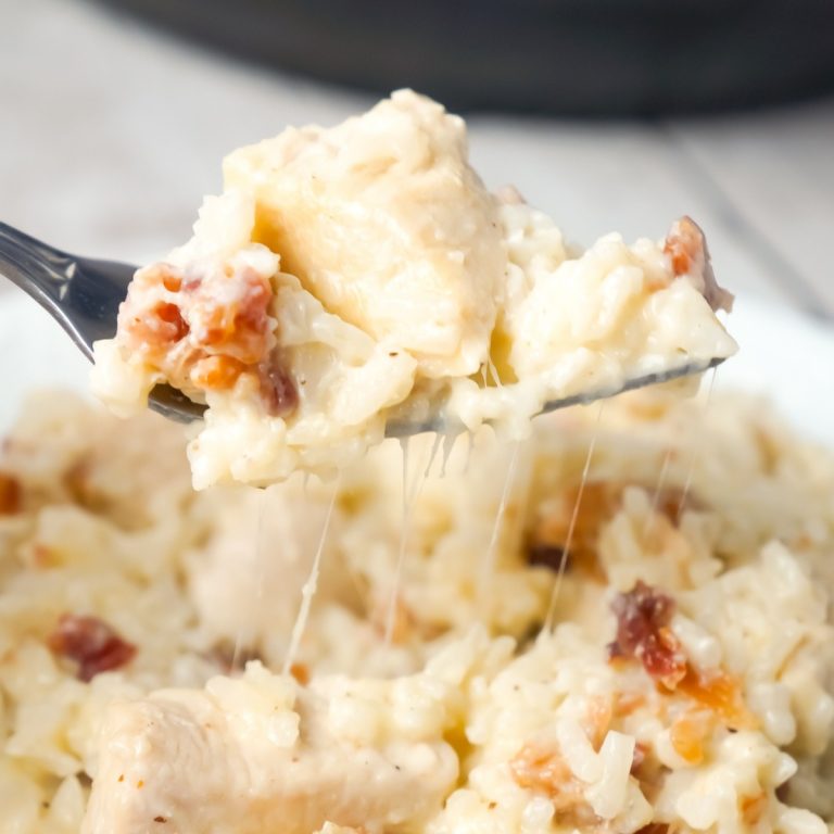 Instant Pot Bacon Parmesan Chicken and Rice is an easy pressure cooker chicken dinner recipe made with boneless, skinless chicken breasts and long grain rice, loaded with crumbled bacon and Parmesan cheese.