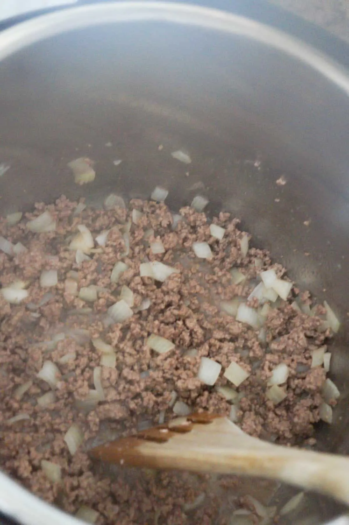 cooked ground beef and onions in an Instant Pot