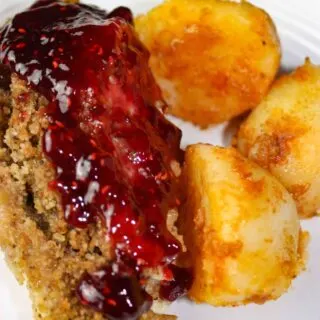 Instant Pot Stuffed Chicken Breasts and Seasoned Potatoes is a gourmet style meal that is very appealing when plated.  Each chicken breast is loaded with gluten free stuffing and then smothered in a tangy raspberry sauce.  