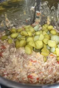 Adding the dill pickles.