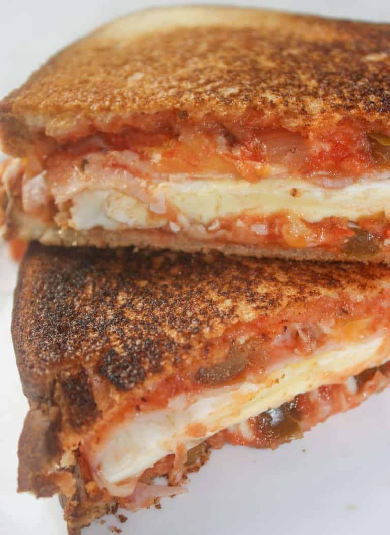 Grilled Tex Mex Breakfast Sandwiches are a great way to start off your day.  Each sandwich is a full meal packed between two slices of gluten free bread with chunky salsa adding a spicy kick!
