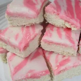 If your life is too busy to make cut out cookies for Valentine's Day this is a great alternative. Iced Sugar Cookie Squares are a sweet and pretty dessert that would be a hit at any Valentine gathering.