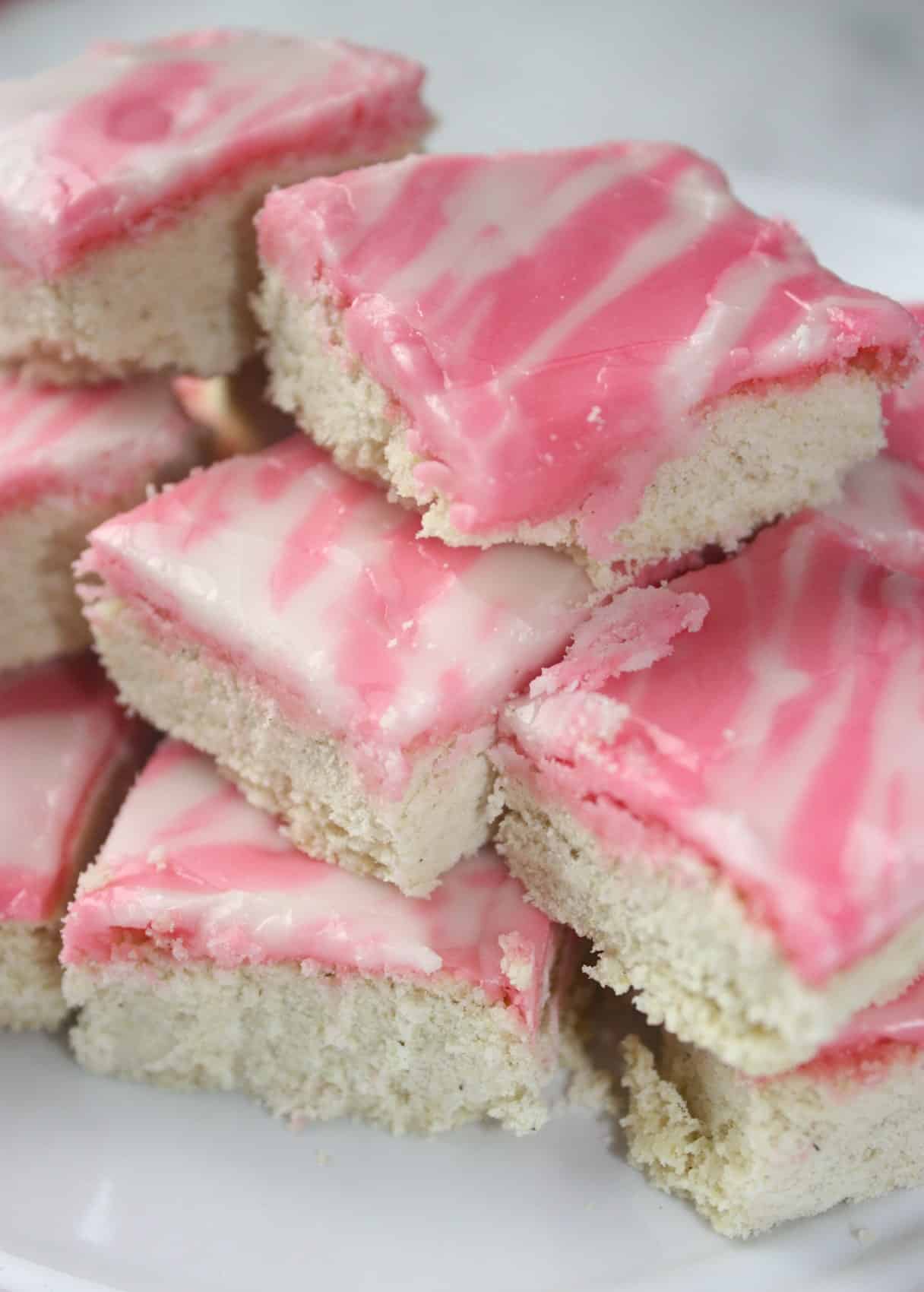If your life is too busy to make cut out cookies for Valentine's Day this is a great alternative. Iced Sugar Cookie Squares are a sweet and pretty dessert that would be a hit at any Valentine gathering.