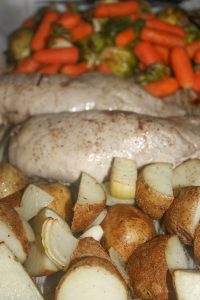 Maple Mustard Pork Tenderloin with Vegetables is a complete dinner cooked on one pan in the oven.  This gourmet meal is topped off with a simple sweet and tangy sauce that really wakes up the taste buds!