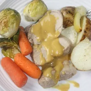Maple Mustard Pork Tenderloin with Vegetables is a complete dinner cooked on one pan in the oven.  This gourmet meal is topped off with a simple sweet and tangy sauce that really wakes up the taste buds!