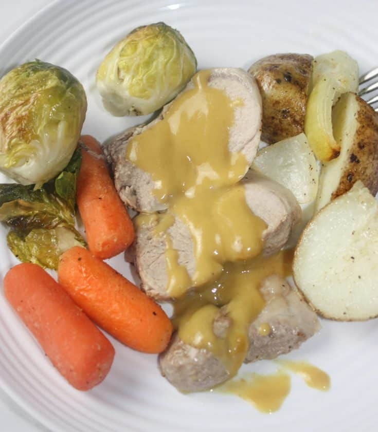Maple Mustard Pork Tenderloin with Vegetables is a complete dinner cooked on one pan in the oven.  This gourmet meal is topped off with a simple sweet and tangy sauce that really wakes up the taste buds!