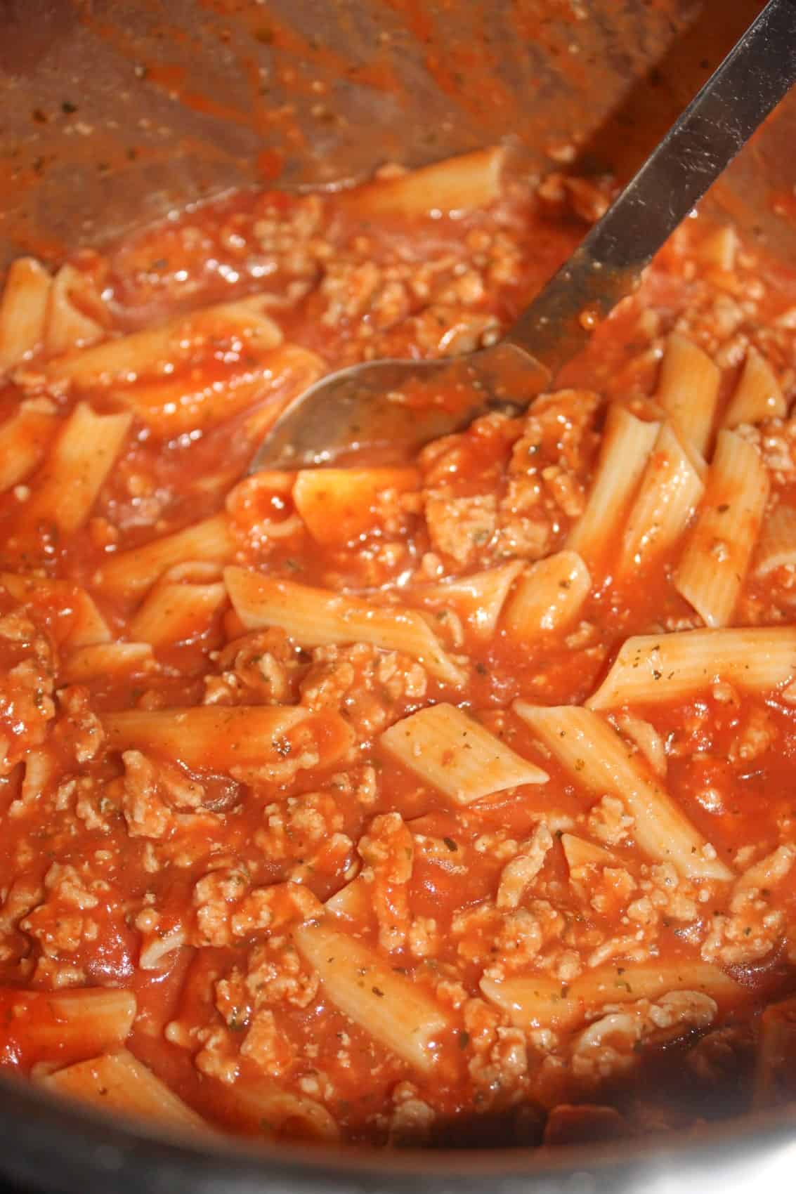 Instant Pot Pasta and Meat Sauce is a simple pressure cooker recipe that can be prepared in under 30 minutes. It is loaded with meat sauce and gluten free pasta.
