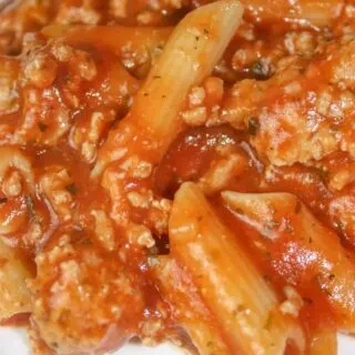 Instant Pot Pasta and Meat Sauce is a simple pressure cooker recipe that can be prepared in under 30 minutes. It is loaded with meat sauce and gluten free pasta.