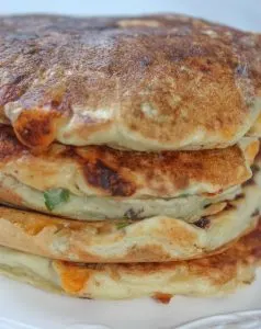 Gluten Free Western Pancakes are a savoury pancake loaded with ham, bacon, onions, green pepper and cheese.  Pour on some sweet, pure maple syrup for a delightful contrast of flavours!