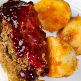 Instant Pot Stuffed Chicken Breasts and Seasoned Potatoes is a gourmet style meal that is very appealing when plated.  Each chicken breast is loaded with gluten free stuffing and then smothered in a tangy raspberry sauce.  