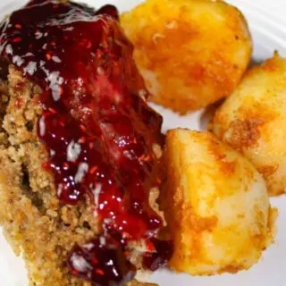 Instant Pot Stuffed Chicken Breasts and Seasoned Potatoes is a gourmet style meal that is very appealing when plated.  Each chicken breast is loaded with gluten free stuffing and then smothered in a tangy raspberry sauce.  