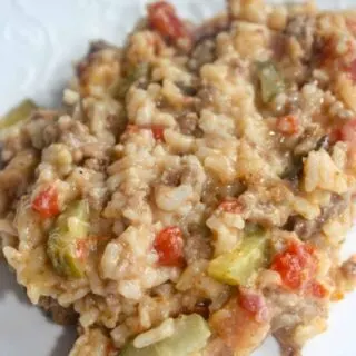 Instant Pot Cheeseburger Rice is a quick pressure cooker meal that serves 8.  It is loaded with ground beef, cheese, rice and provides an extra burst of flavour from the addition of dill pickles!  