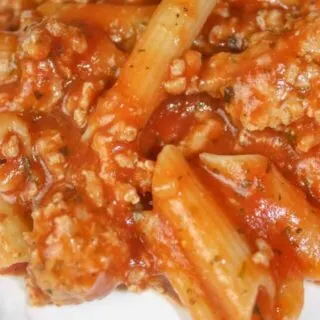 Instant Pot Pasta and Meat Sauce is a simple pressure cooker recipe that can be prepared in under 30 minutes. It is loaded with meat sauce and gluten free pasta.