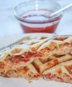 Peppery mozzarella cheese, topped with bacon slices, layered between slices of gluten free bread pressed in the waffle iron to create an appetizing delight. Spicy Waffled Grilled Cheese with Bacon wakes up the taste buds with a burst of heat.