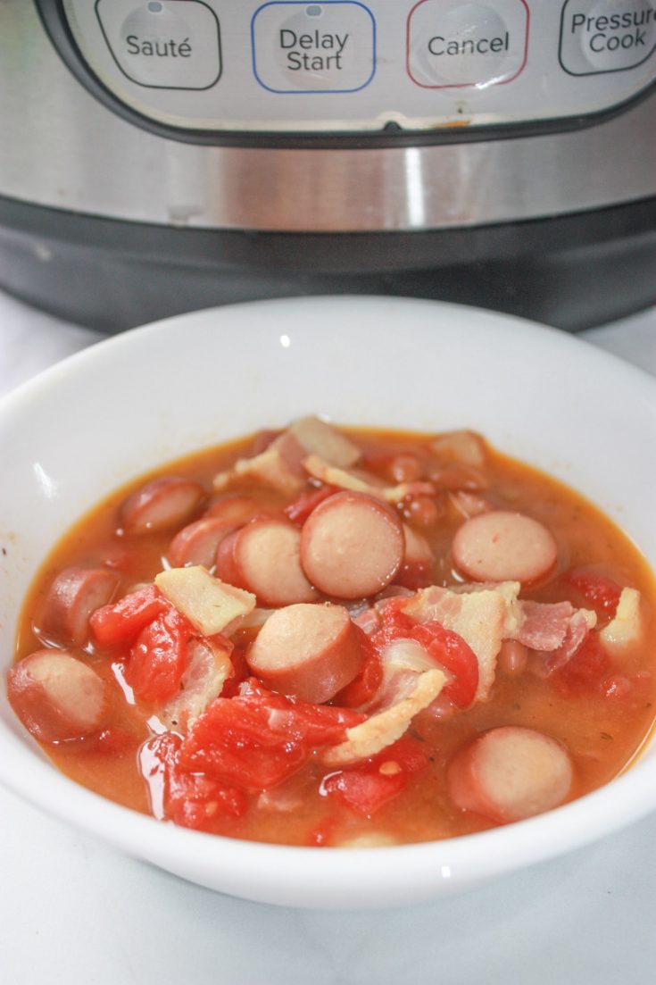 Instant Pot Pork and Bean Soup is an easy comfort meal for the whole family.  Loaded with bacon and weiners it is sure to be a hit with young and old alike!