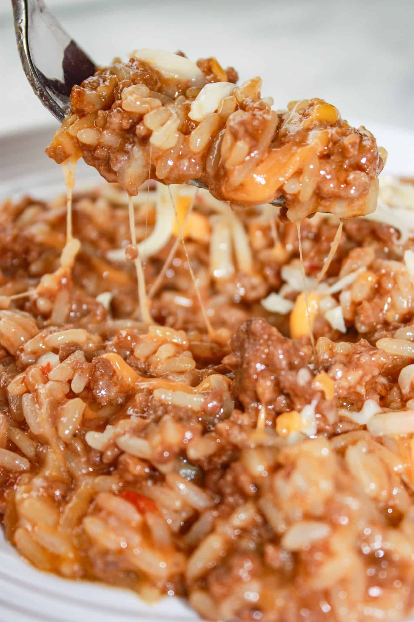 Instant Pot Cheesy BBQ Ground Beef and Rice can be on your table in short order any day of the week.  It is a enrobed in a delightful sauce that is a combination of sweet and smoky with a bit of heat.