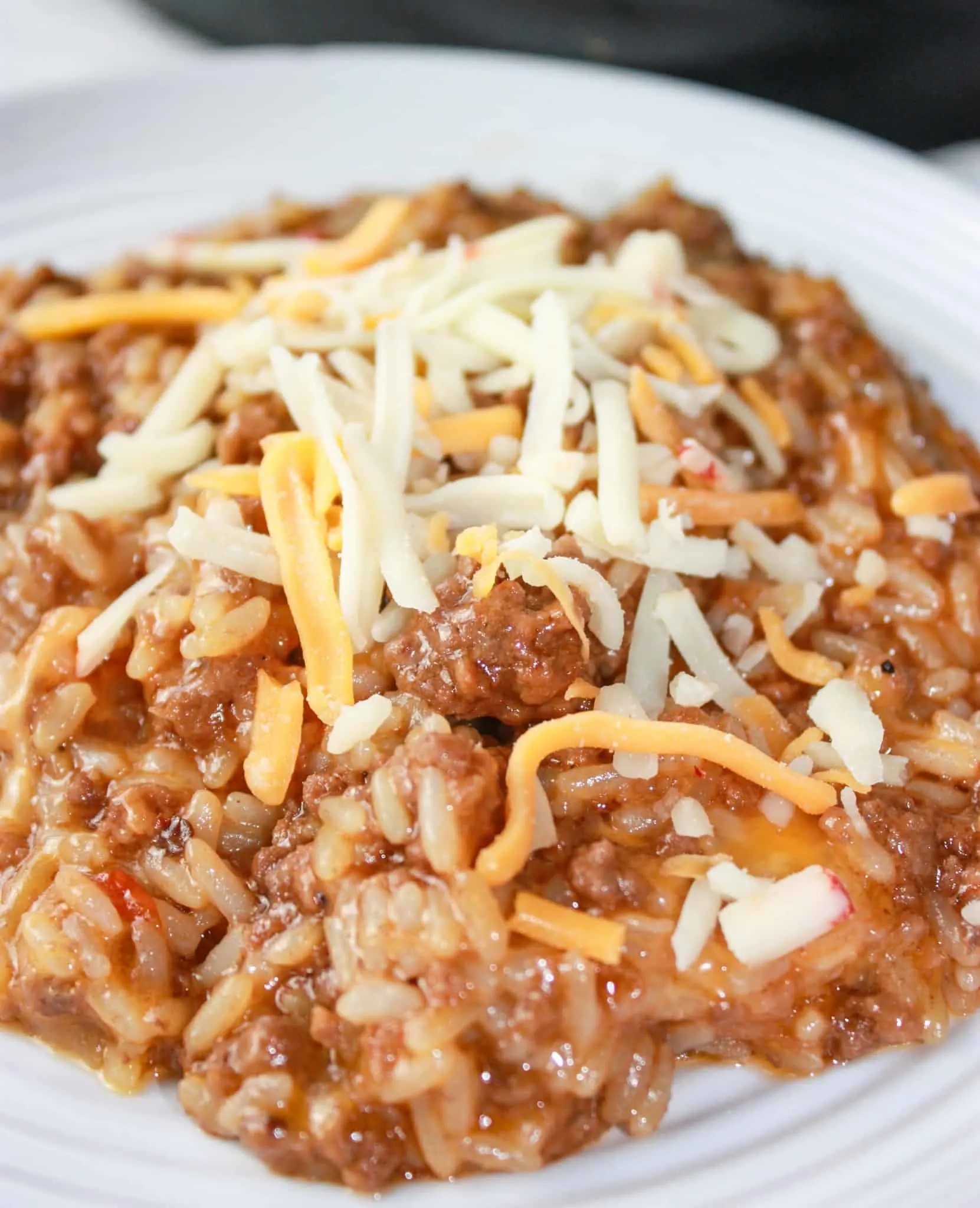 Instant Pot Cheesy BBQ Ground Beef and Rice can be on your table in short order any day of the week.  It is a enrobed in a delightful sauce that is a combination of sweet and smoky with a bit of heat.
