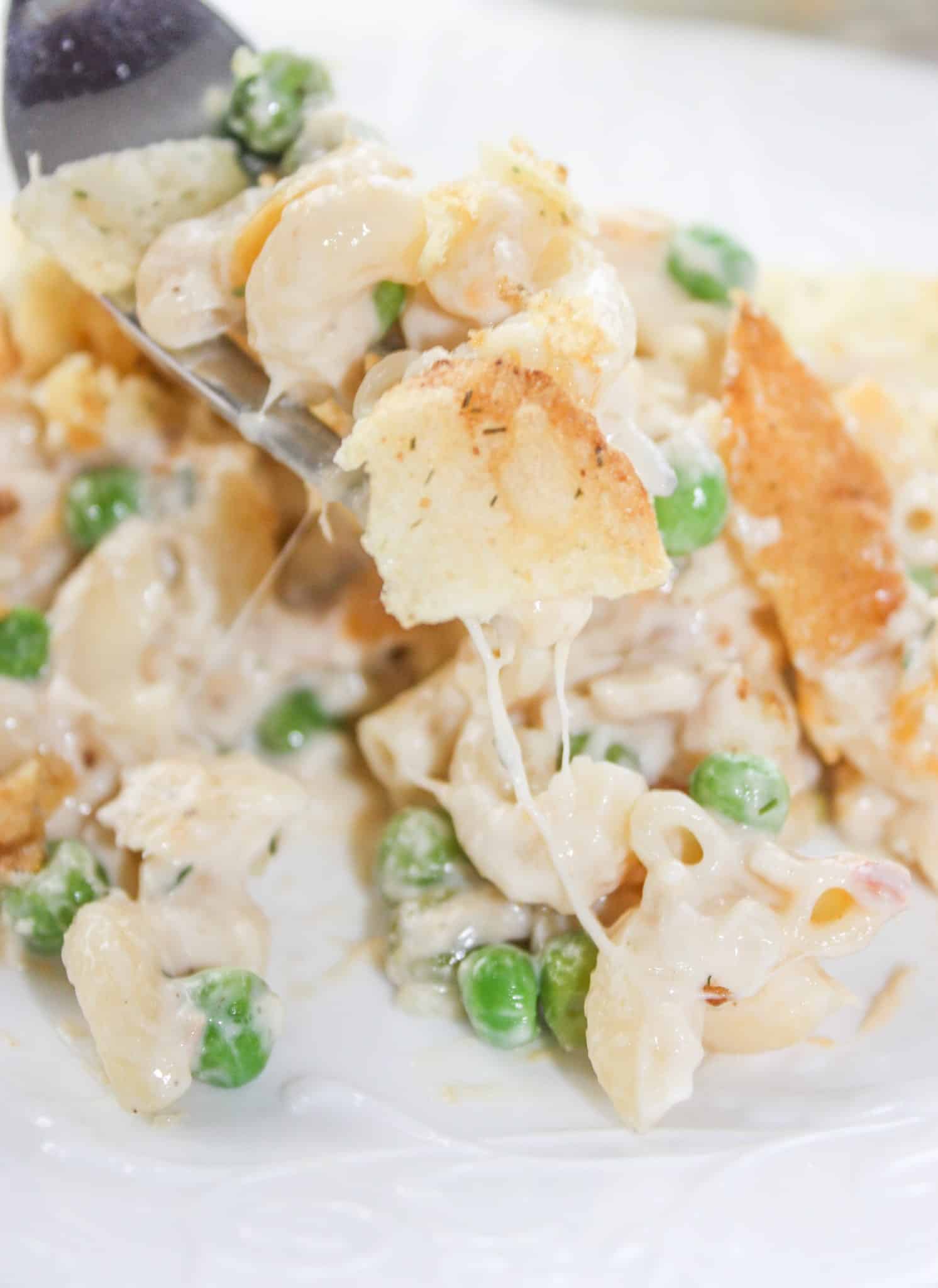 Gluten Free Tuna Casserole is an easy dinner recipe that combines canned tuna with cheesy pasta and frozen peas. This gluten free version of a family staple will not disappoint!