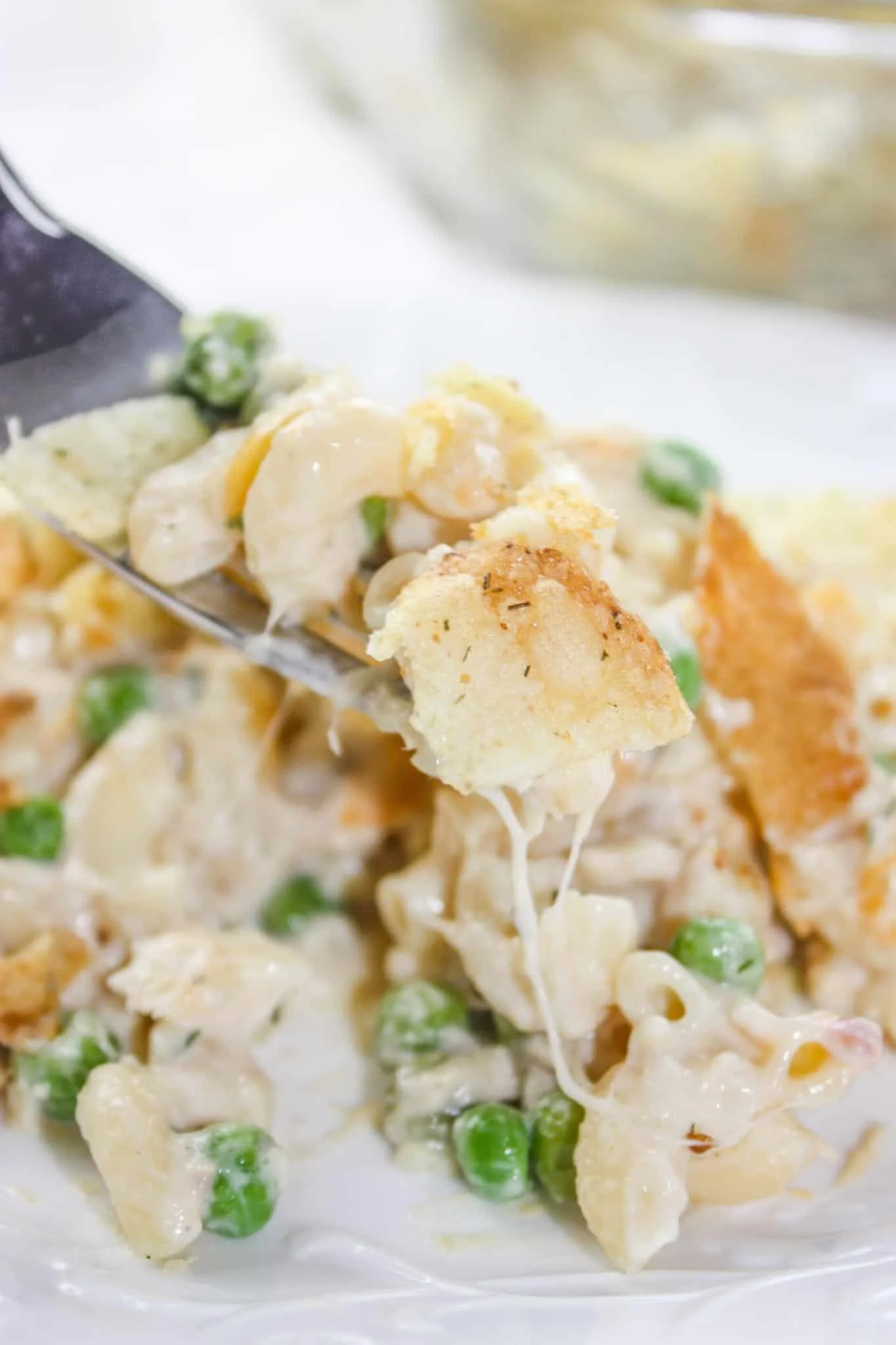 Gluten Free Tuna Casserole is an easy dinner recipe that combines canned tuna with cheesy pasta and frozen peas. This gluten free version of a family staple will not disappoint!