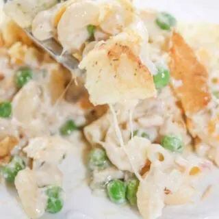 Gluten Free Tuna Casserole is an easy dinner recipe that combines canned tuna with cheesy pasta and frozen peas. This gluten free version of a family staple will not disappoint!