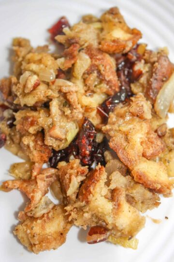 Instant Pot Festive Stuffing is a twist on my traditional stuffing. This gluten free stuffing has the added flavours of dried cranberries, bacon and pecans.