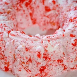 Strawberry Banana Mandarin Jello Mold is a sweet and tasty side dish that adds a burst of colour to holiday get togethers!